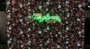 Tanqueray neon on flower wall